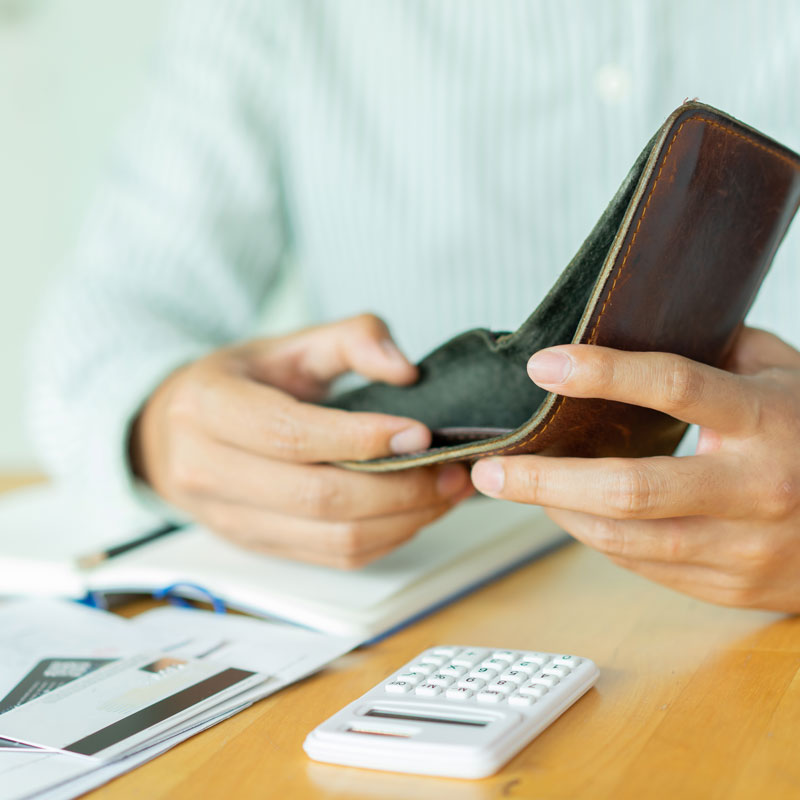 Man showing an empty wallet to illustrate the cost of filing bankruptcy in Los Angeles, California