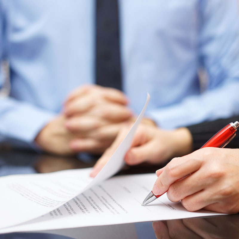 Client and lawyer signing Living Trust paperwork at Richards & Richards Law Firm in Los Angeles, CA