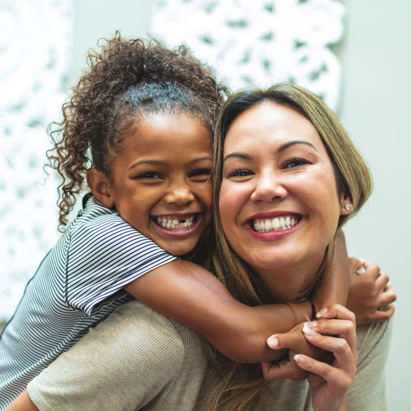 Mother and adopted daughter sharing a joyful moment in Ogden, UT