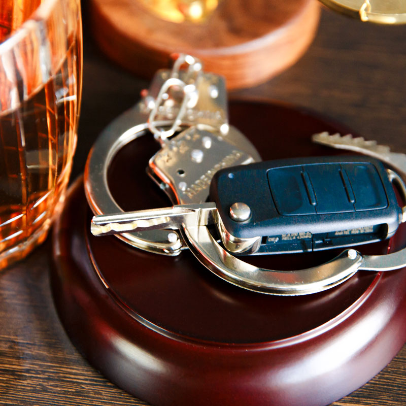 Car keys next to handcuffs symbolizing DUI arrest in Ogden, UT by Richards & Richards Law Firm