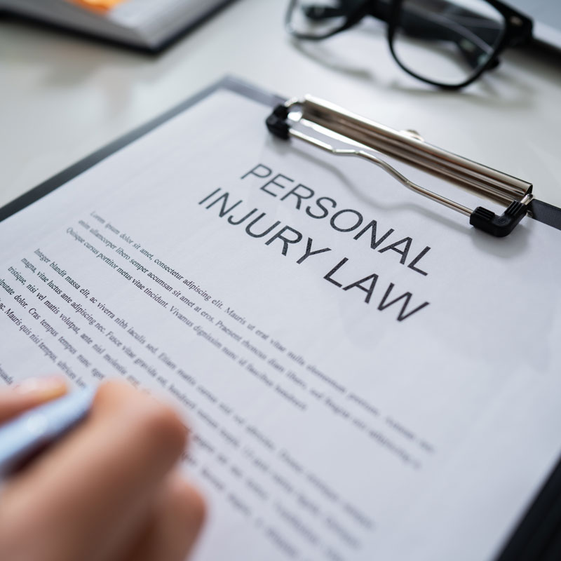 Lawyer in Los Angeles, CA, reading personal injury law paperwork