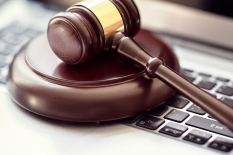 Gavel resting on a laptop symbolizing Justice Court legal services in Ogden, UT - Richards & Richards Law Firm