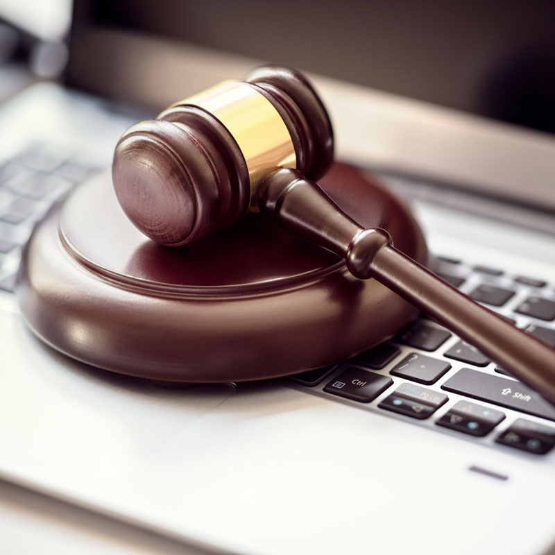 Gavel resting on a laptop symbolizing Justice Court legal services in Ogden, UT - Richards & Richards Law Firm