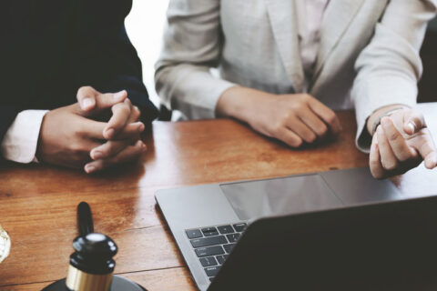 Lawyer and client discussing trust litigation process in Ogden, UT office