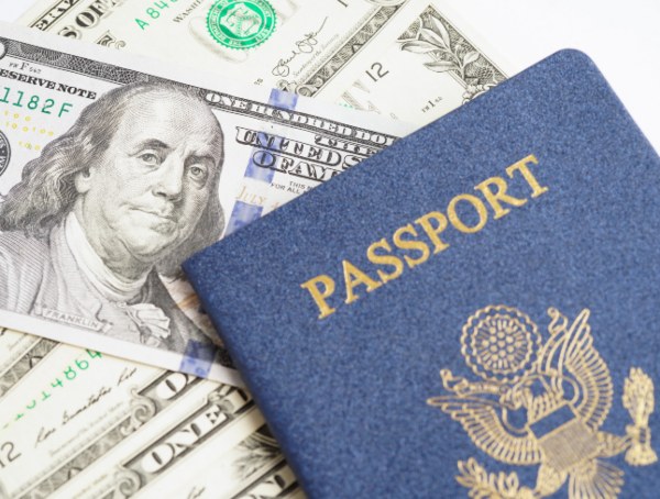 USA passport and dollars - USCIS fee adjustments